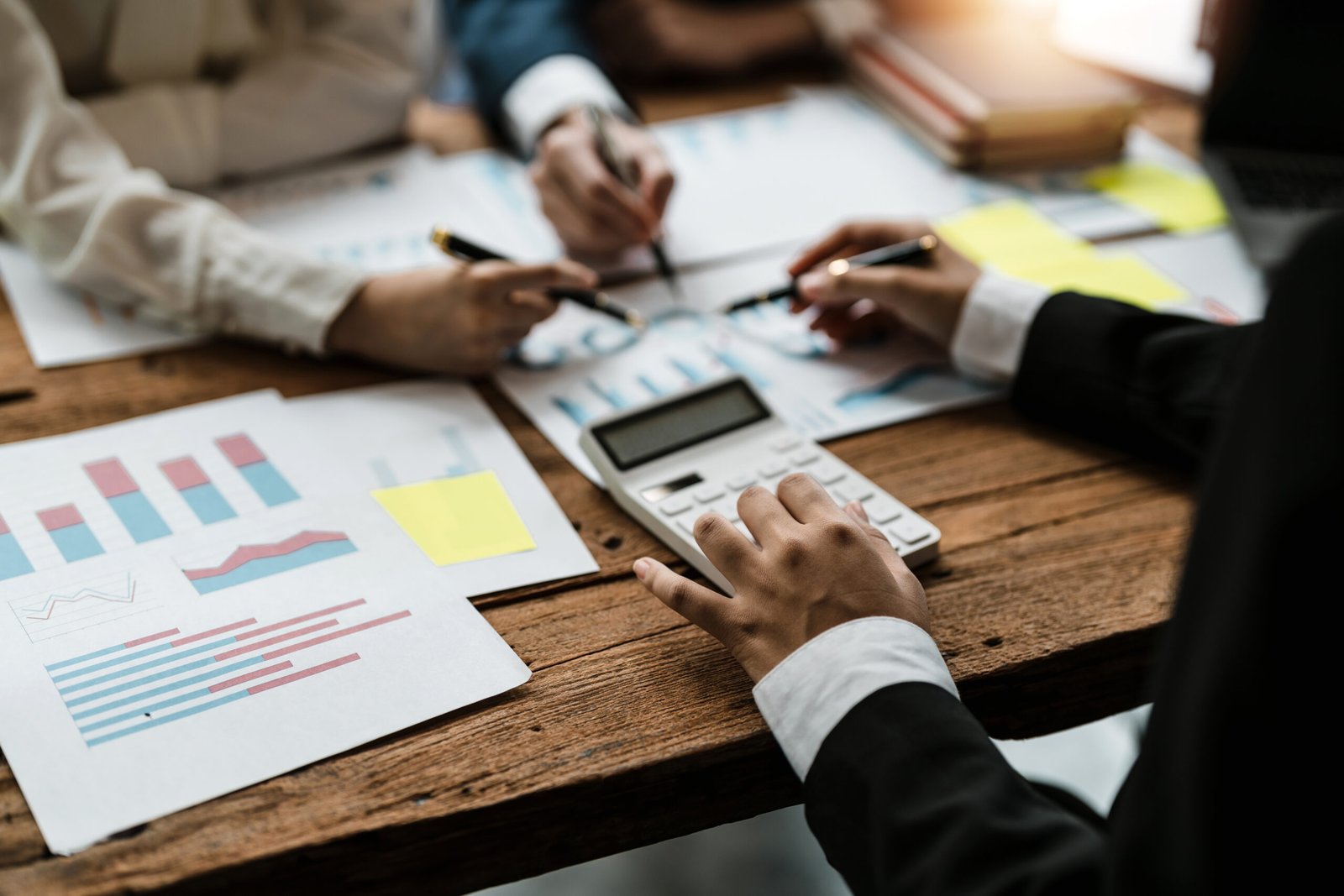 Business adviser meeting to analyze and discuss the situation on the financial report in the meeting room. Investment Consultant, Financial advisor and accounting concept.