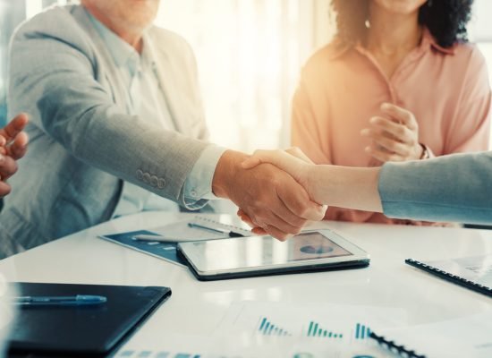 Shaking hands, thank you and business people in office for meeting with finance deal or partnership. Agreement, applause and financial advisors with handshake for congratulations on investment goal